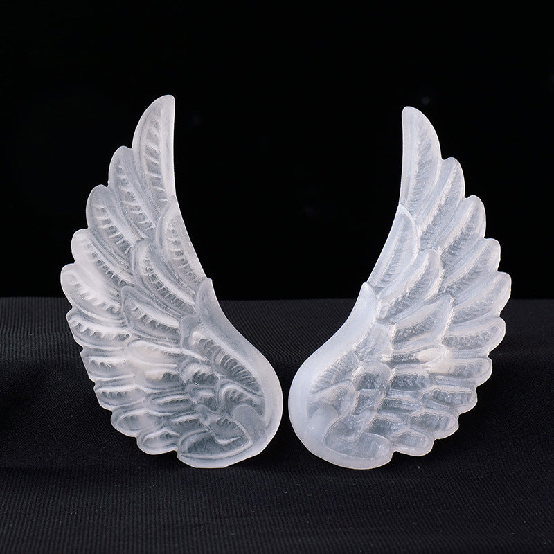 It's a pair of transparent selenite angel's wings, the beautiful selenite crystals are often used for decoration and energy-cleansing purpose.