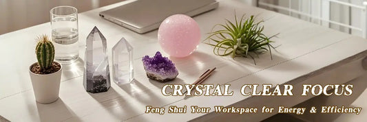 Header image showing a modern desk with decorative crystals—clear quartz pointer, amethyst cluster, and rose quartz ball, related to the title "Crystal clear focus: feng shui your workspace for energy and efficiency.